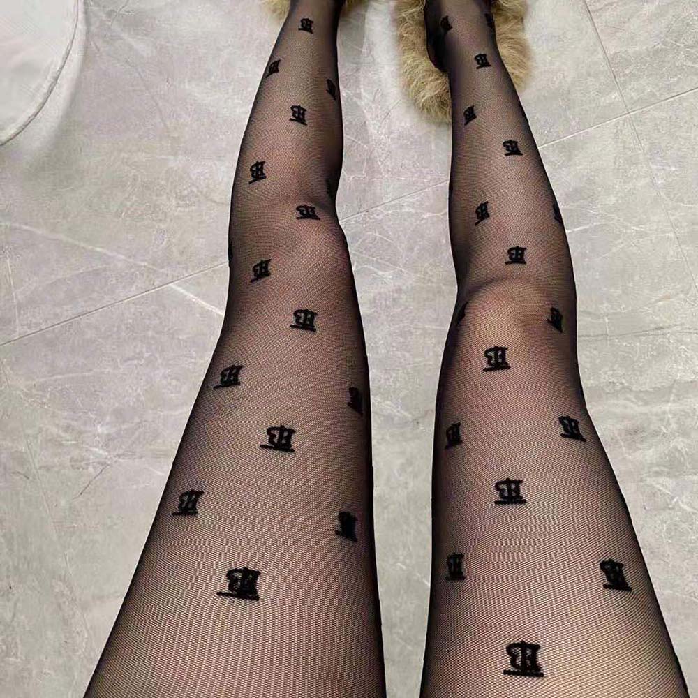 Close-up of black sheer fabric and crystal lettering on Burberry Women Tights