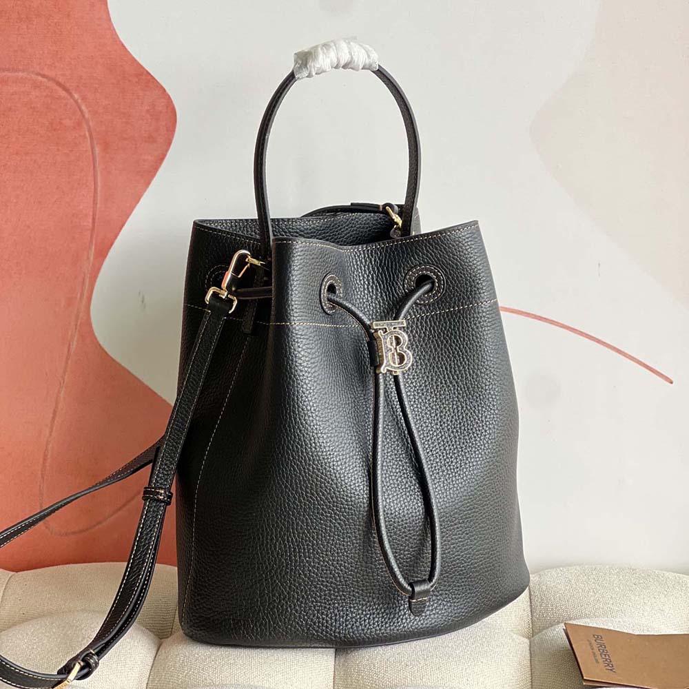 Side angle showing grainy leather texture of Burberry Women Grainy Leather Small TB Bucket Bag-Black