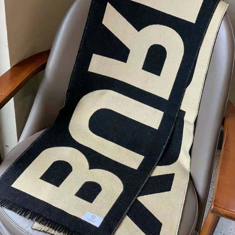 Side angle showing texture and length of Burberry Women Logo Wool Jacquard Scarf-Brown