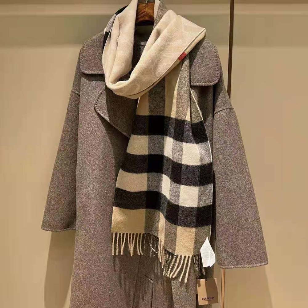 Close-up detail of Burberry scarf’s reversible cashmere fabric and patterns