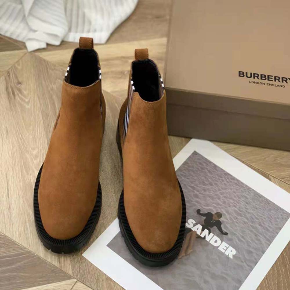 Close-up of vintage check detail on Burberry Chelsea Boots-Brown