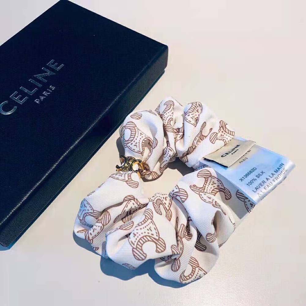 Styled wrist wearing the Celine Women Scrunchy Celine Triomphe Monogram Bracelet