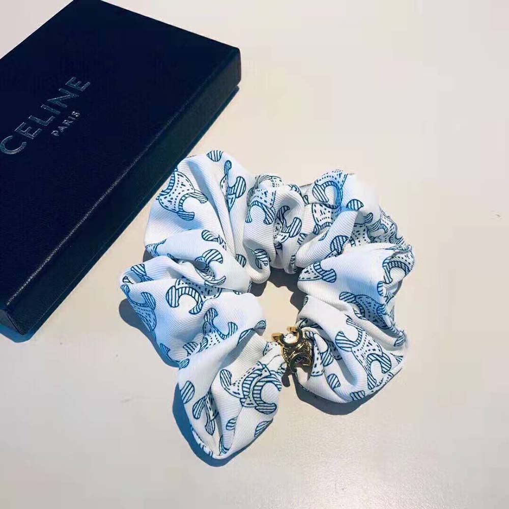 Styled wrist shot of Celine Women Scrunchy Celine Triomphe Toile De Jouy Bracelet with navy silk details