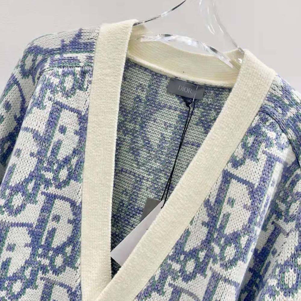 Side profile showing Dior Oblique pattern on white cardigan
