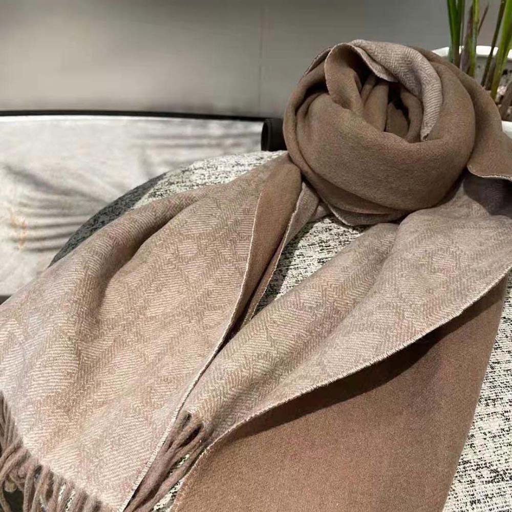 Close-up detail of Dior Oblique pattern on scarf fabric