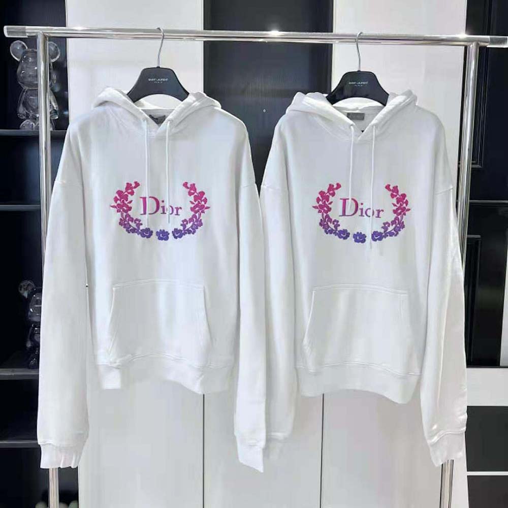 Close-up of Dior embroidery on white cotton fleece sweatshirt