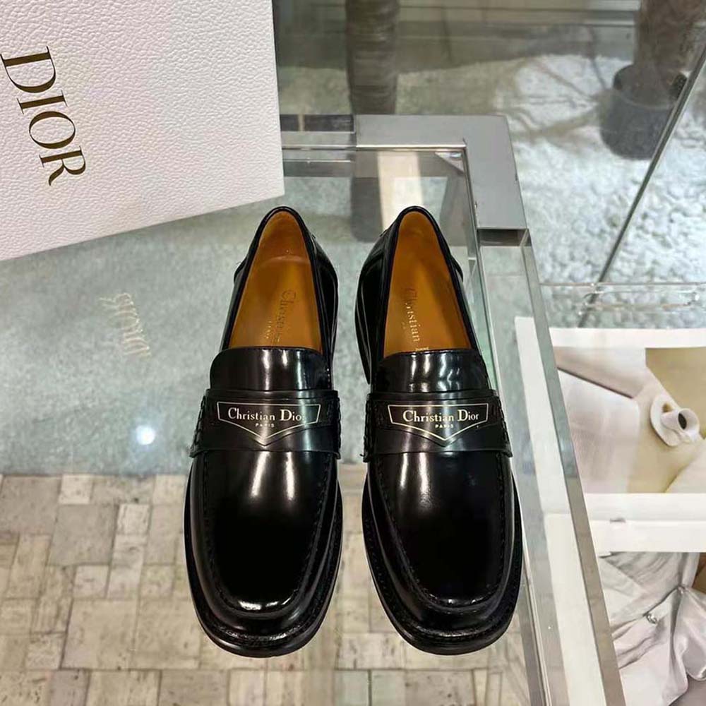 Close-up of brushed calfskin and Dior metal hardware on loafer