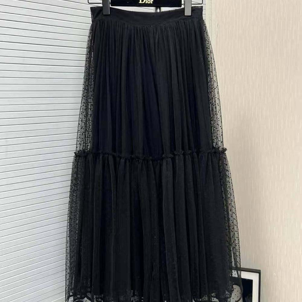 Close-up of black plumetis tulle texture on Dior skirt