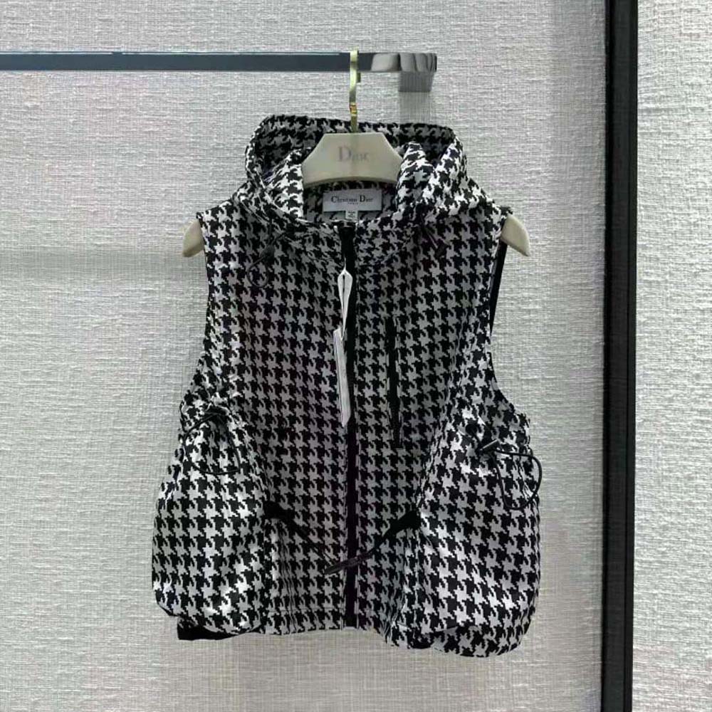 Close-up detail of macro houndstooth jacquard on Dior sleeveless vest