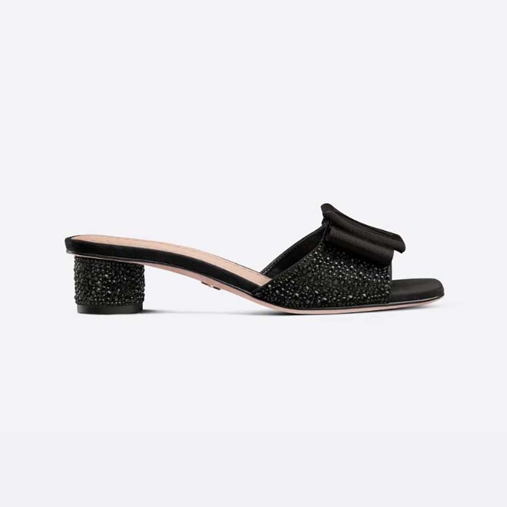 Side view of Dior Women Idylle Heeled Slide in black suede
