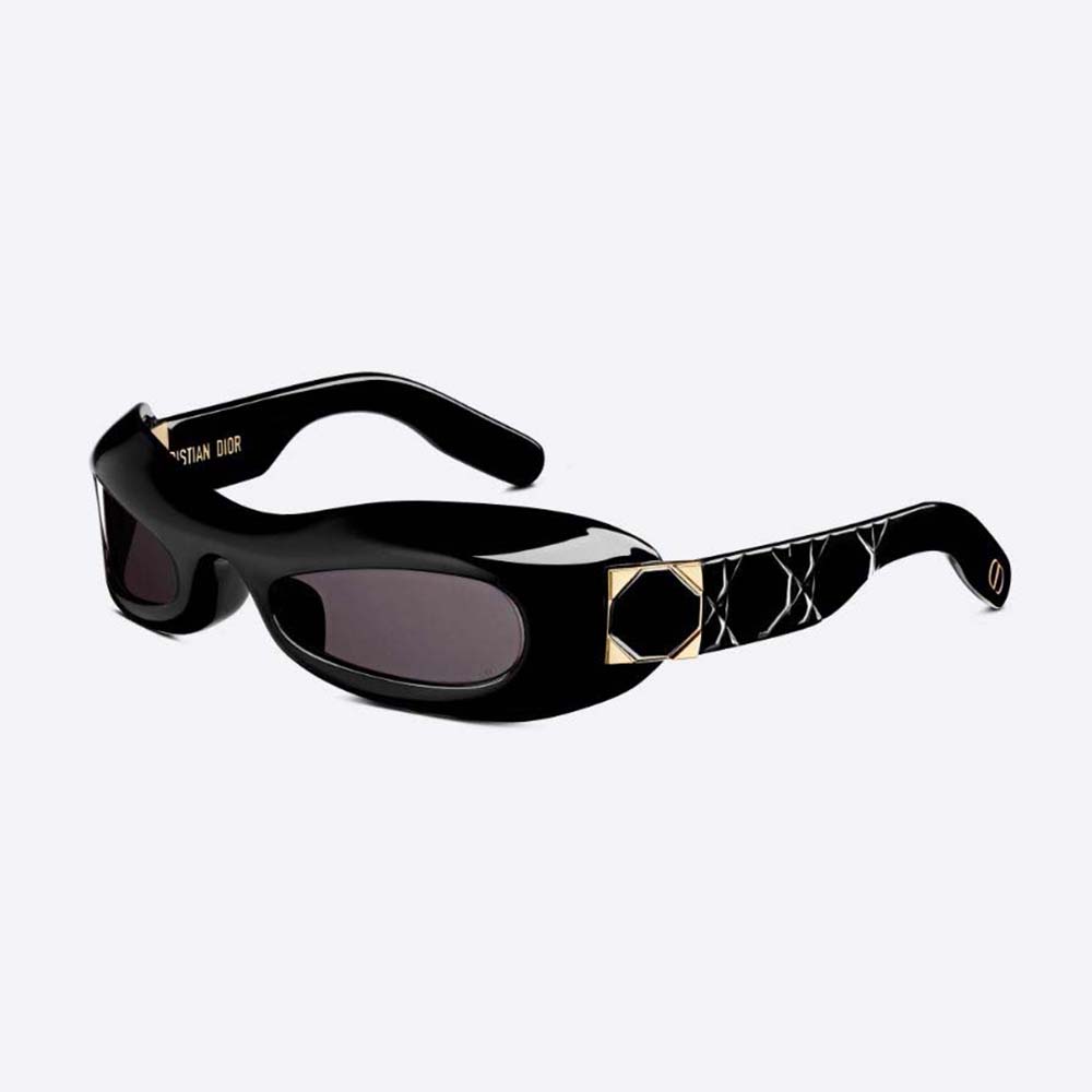 Close-up on silver Dior logo hardware on black rounded sunglasses