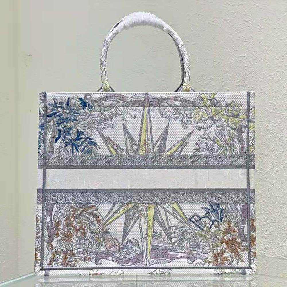 Side angle showing the open-top and leather handles of Dior Women Large Dior Book Tote