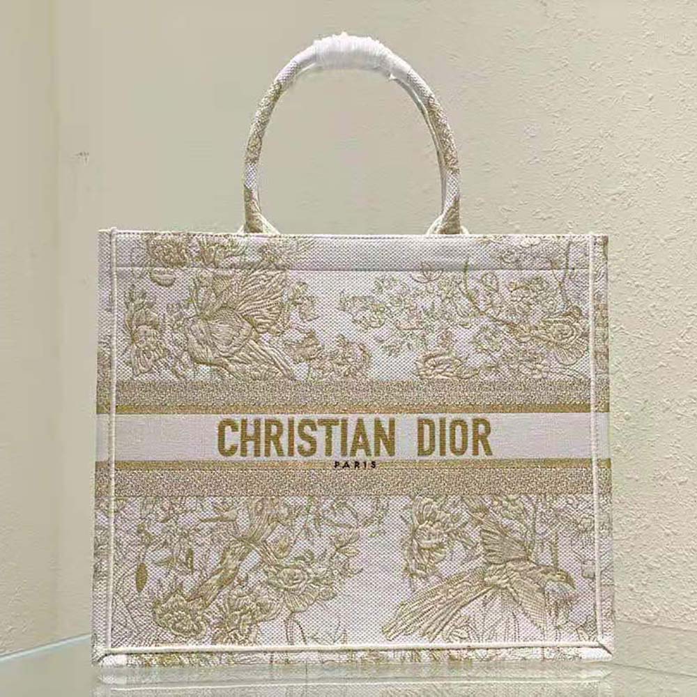 Close-up detail of gold-tone metallic thread embroidery on Dior Book Tote