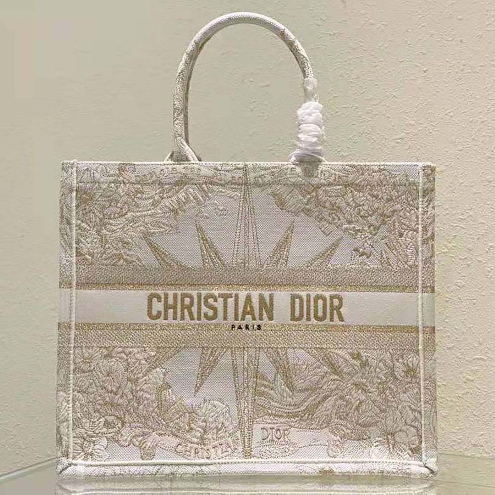 Close-up detail of gold-tone metallic thread embroidery on Dior Women Medium Dior Book Tote