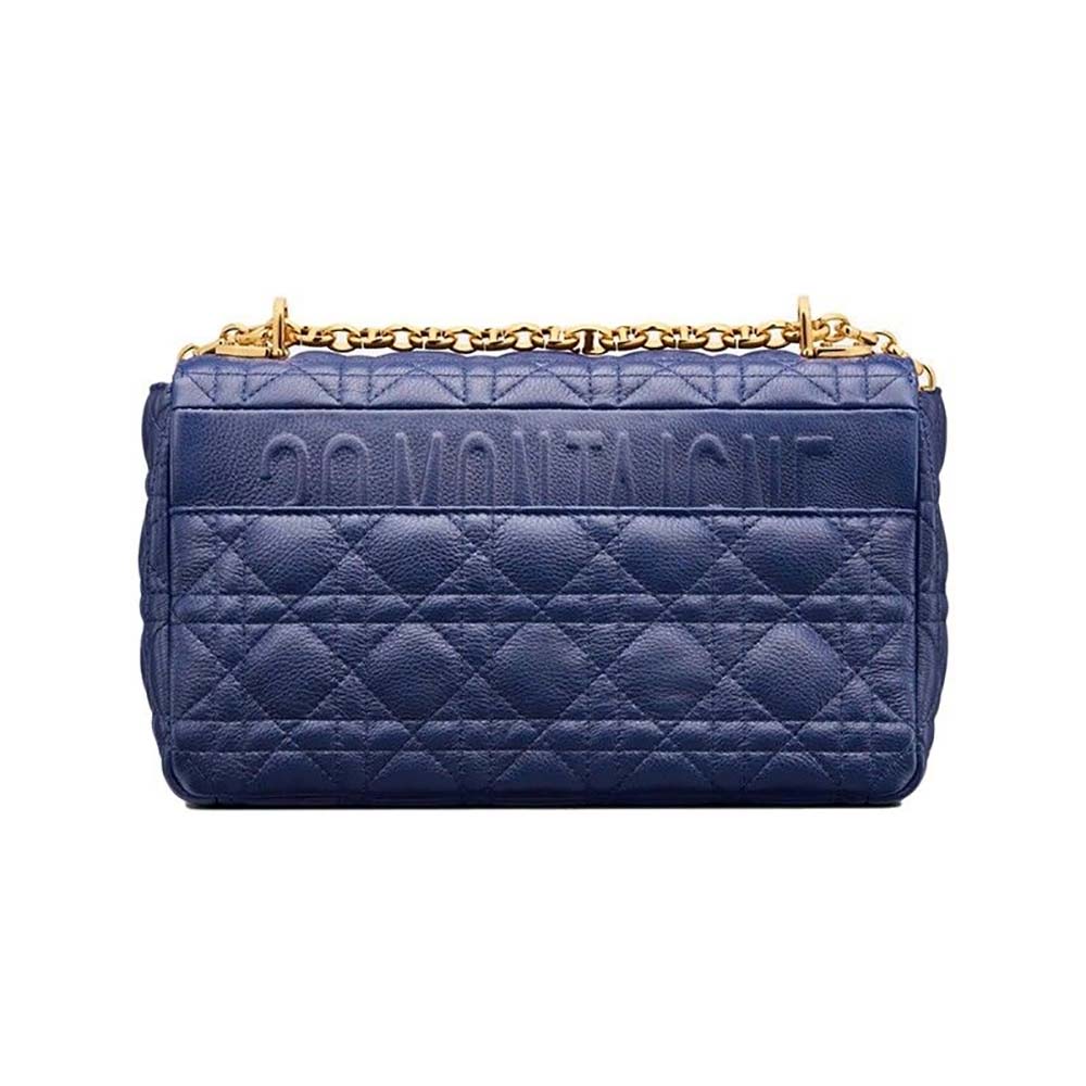 Side profile showing soft silhouette of Dior Women Medium Dior Caro Bag Royal Blue