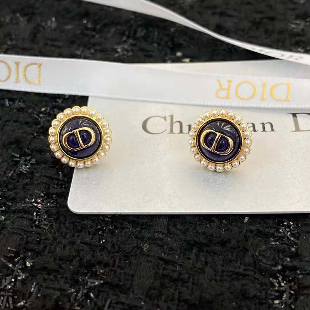Close-up detail of Dior Women Petit CD Studs Earrings showing black glass and pearl accents