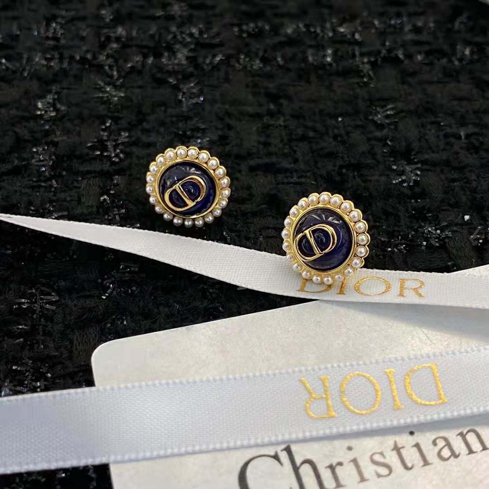 Side angle of Dior Women Petit CD Studs Earrings highlighting gold-finish metal and secure closure