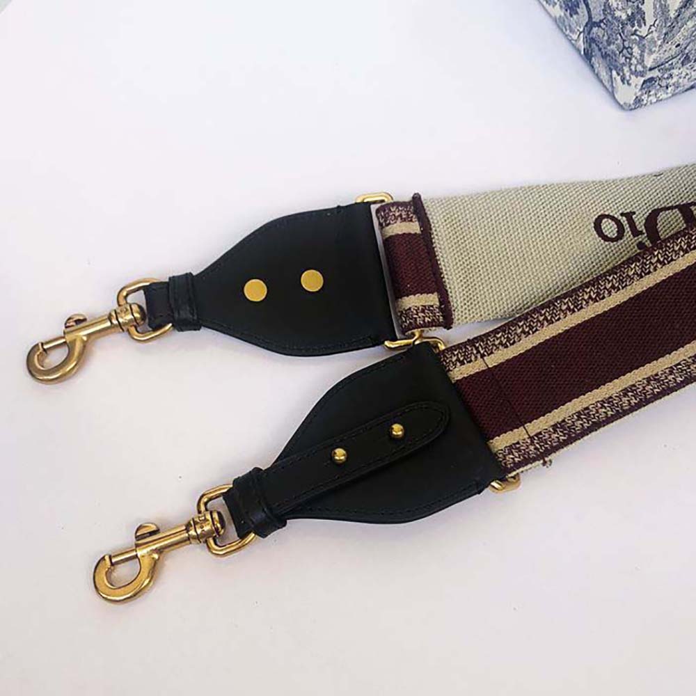 Side angle showing silver-tone ring hardware on Dior shoulder strap
