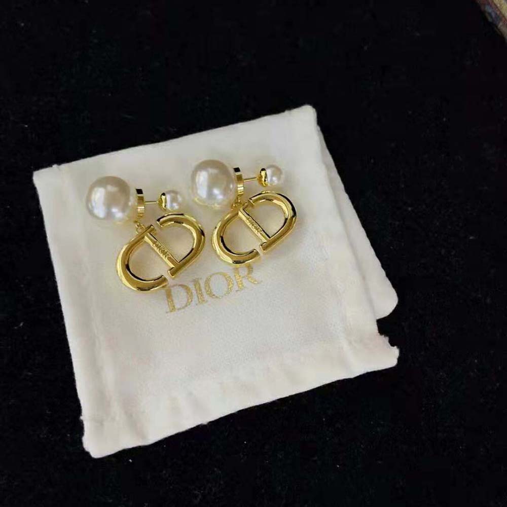 Model wearing Dior Women Tribales Earrings with elegant outfit