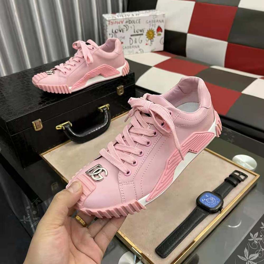 Overhead view showing lace-up closure on Dolce Gabbana pink sneakers