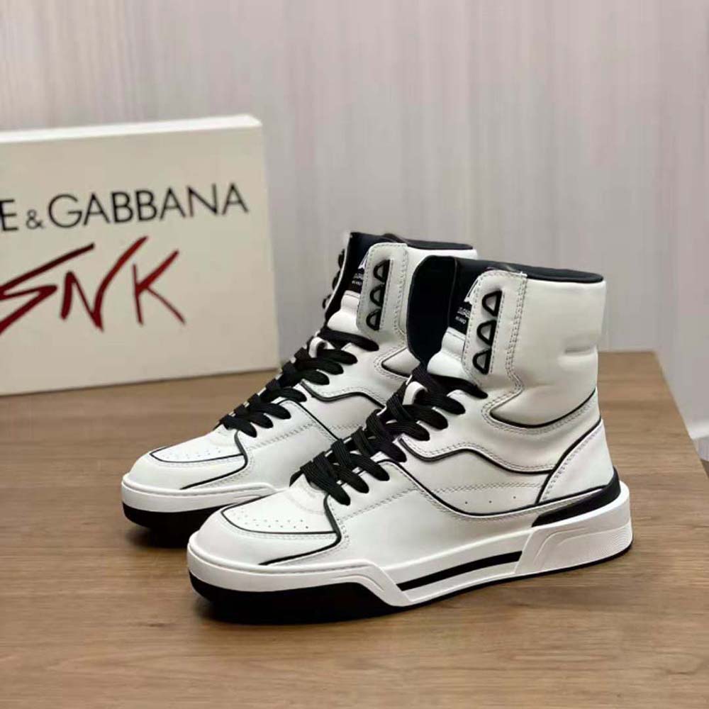 Top angle showing lace-up closure and mid-top silhouette sneakers