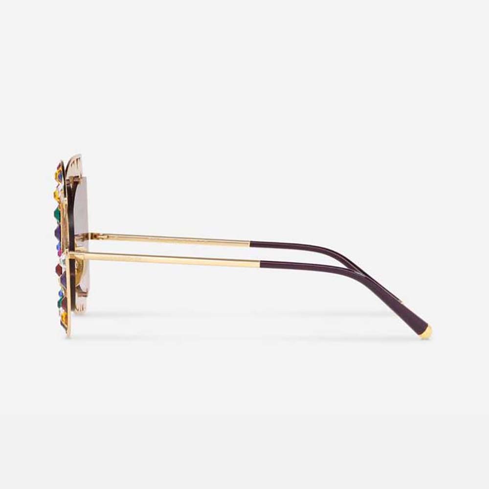 Side profile showing pink acetate frame and lens of Dolce Gabbana sunglasses