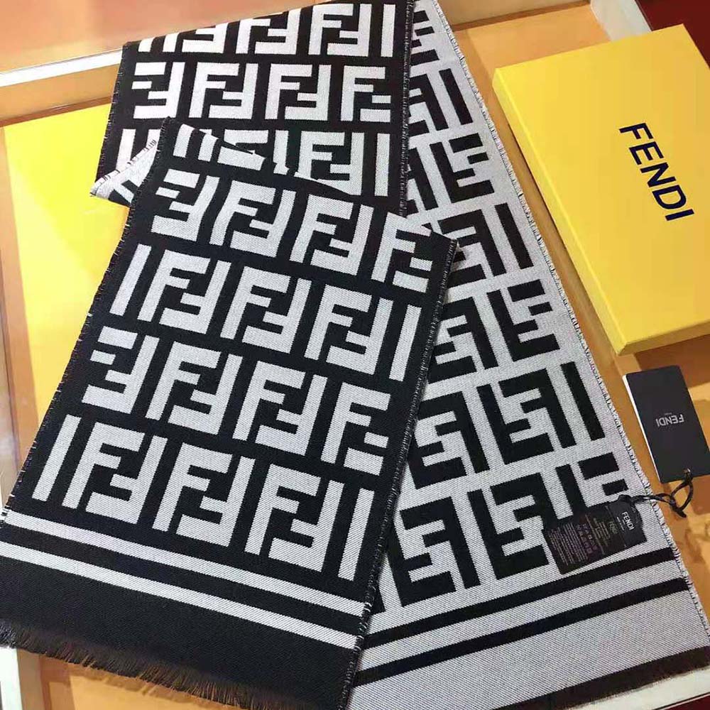 Close-up of Fendi logo detail on beige wool and silk scarf