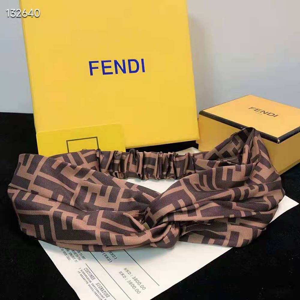 Close-up of signature FF hardware on Fendi silk bandeau top