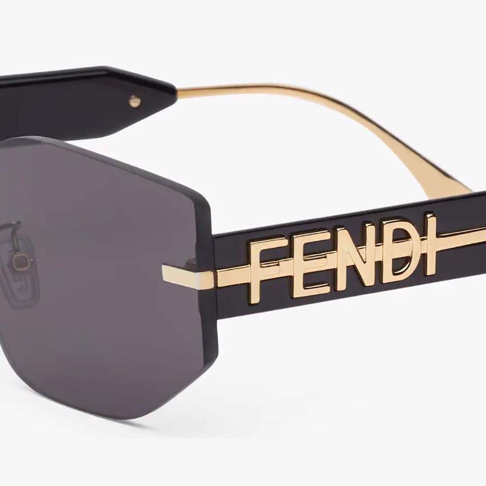 Side angle of Fendi Women Fendigraphy Black Shield Sunglasses highlighting sleek acetate frame
