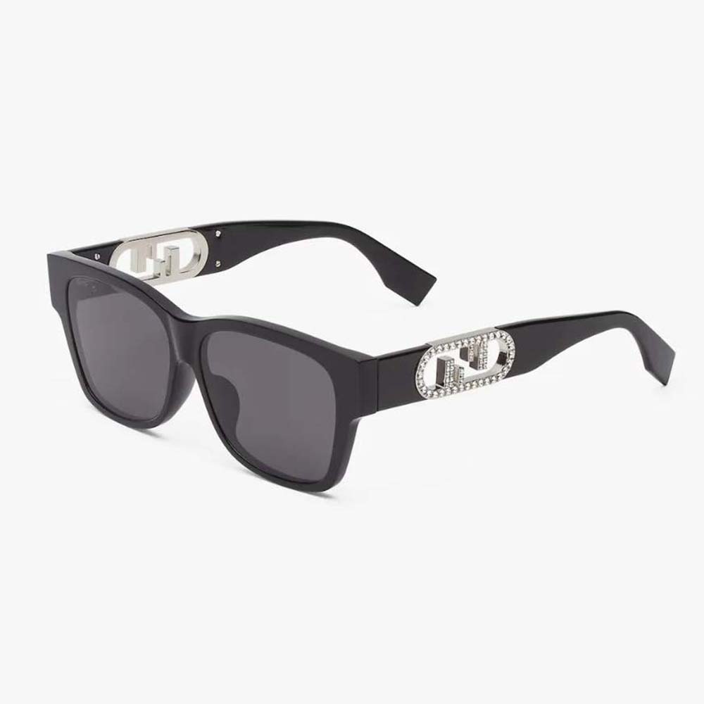Side close-up showing crystal Fendi logo on black acetate sunglasses
