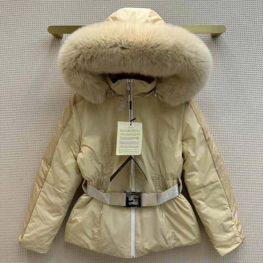 Close-up of signature Fendi hardware on beige nylon ski jacket