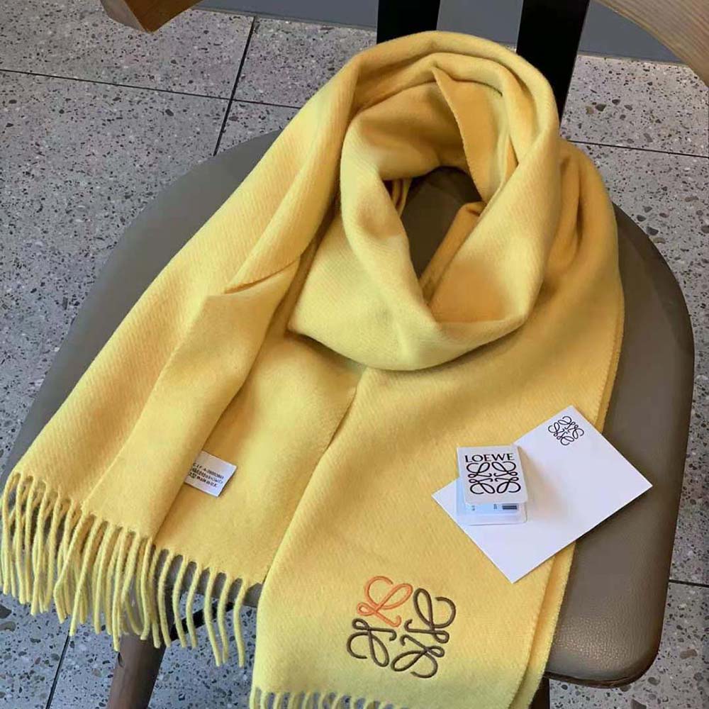Close-up of embossed Anagram logo on yellow Loewe Women Anagram Scarf