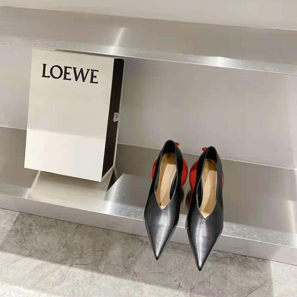 Close-up of black calfskin and Loewe embossed hardware on balloon pump