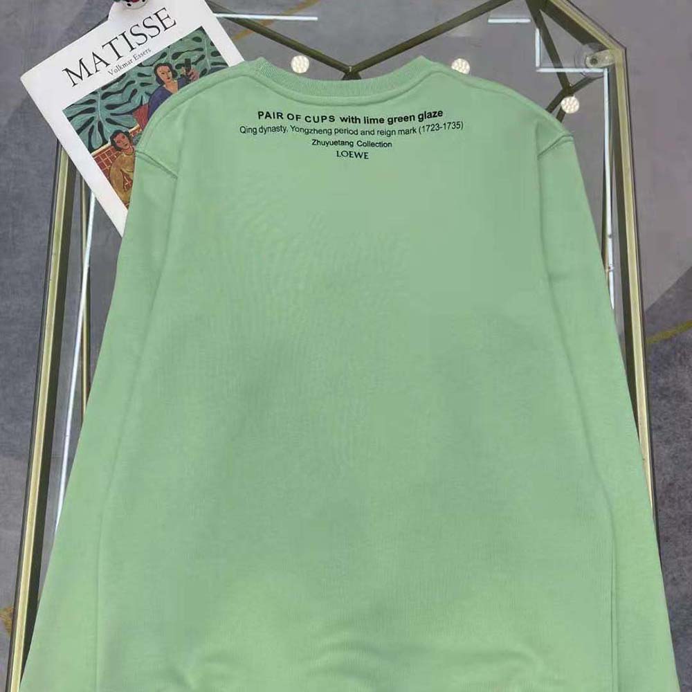 Side profile showing fit of Loewe Women Ceramic Print Sweatshirt in Cotton-Lime
