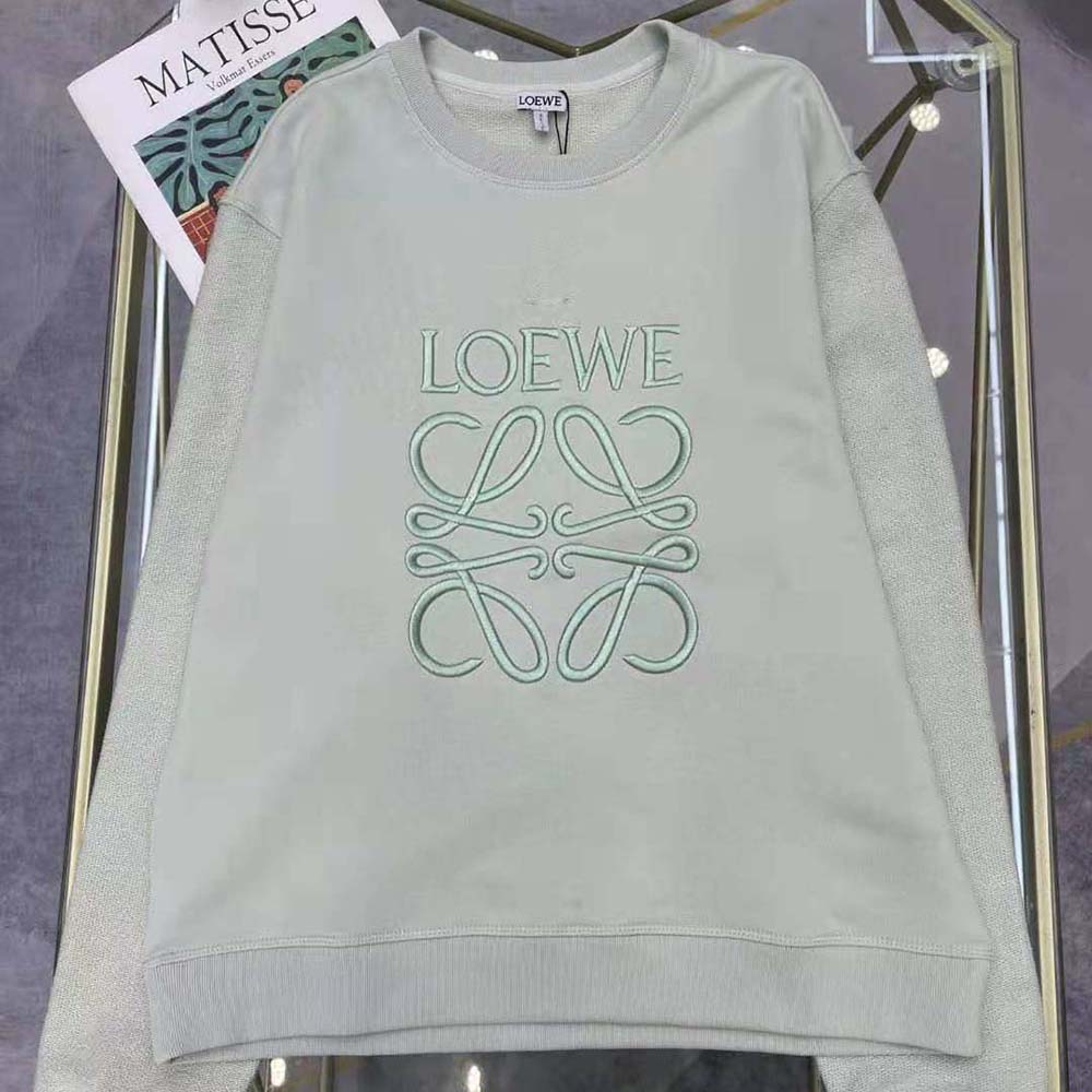 Close-up of embroidered LOEWE Anagram detail on lime cotton sweatshirt