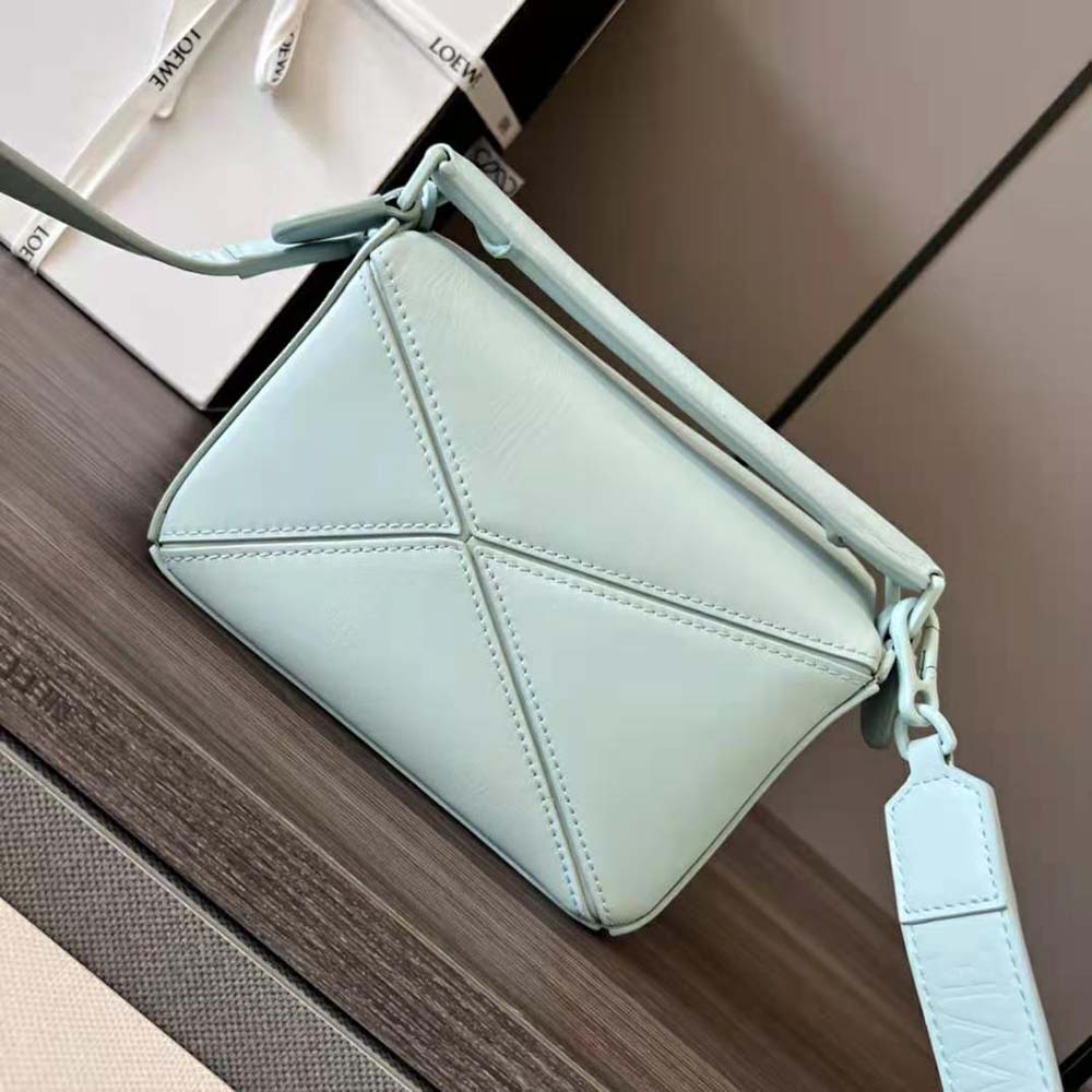 Side angle showing compact silhouette of Loewe Women Mini Puzzle Bag