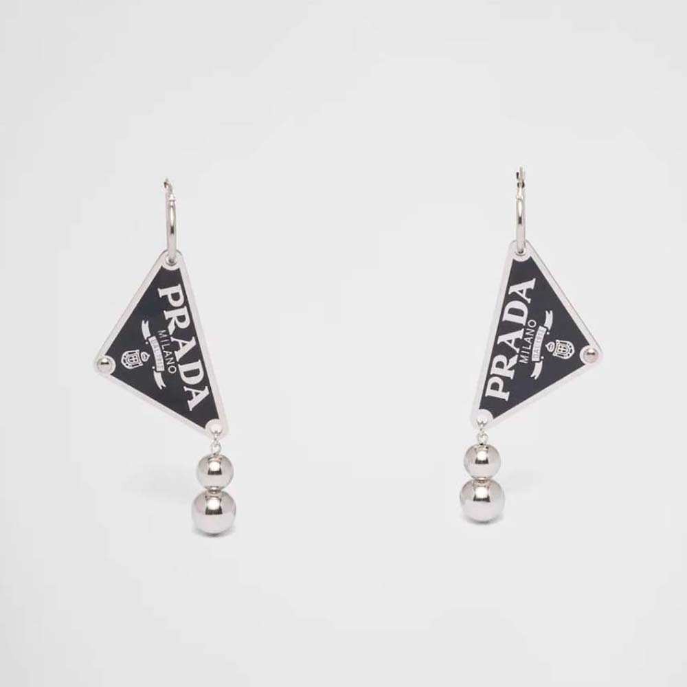 Close-up of Prada Women Ball Smalto Jewels Pendant Earrings black enamel detail