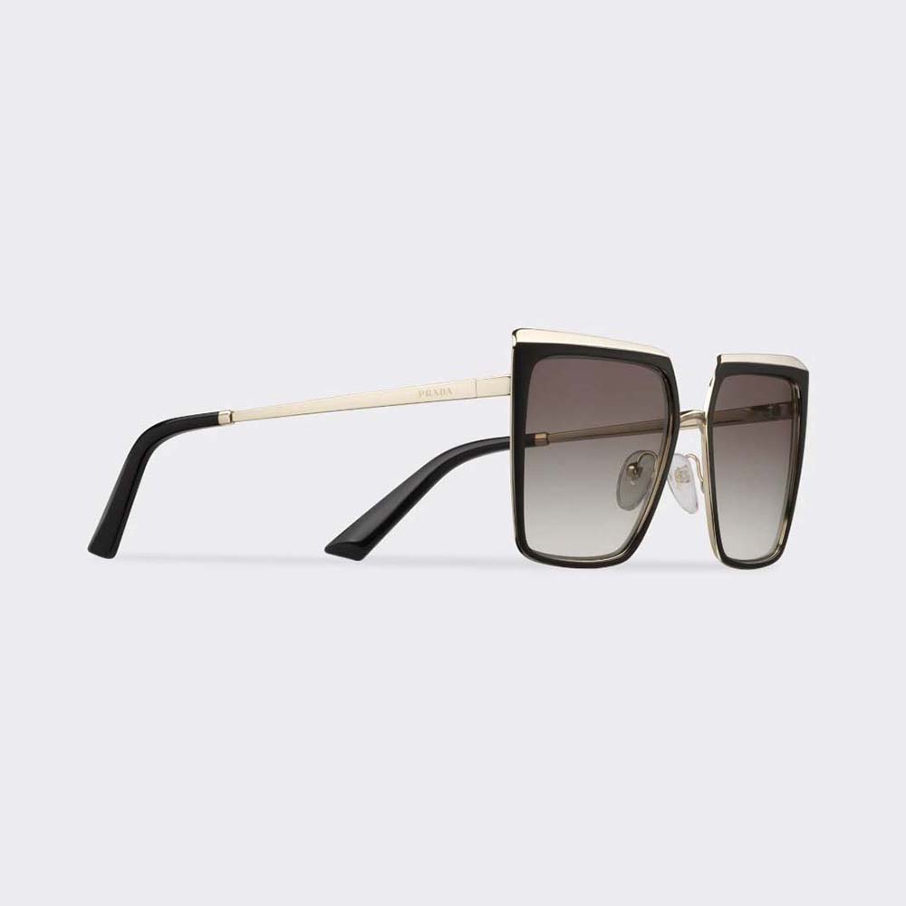 Close-up of gold logo detail on Prada Women Cinéma Sunglasses temple