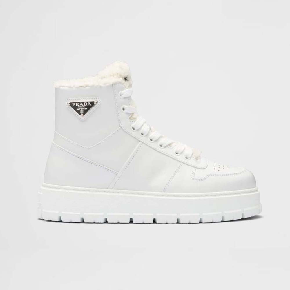 Side view of Prada Women Leather and Shearling High-Top Sneakers-White