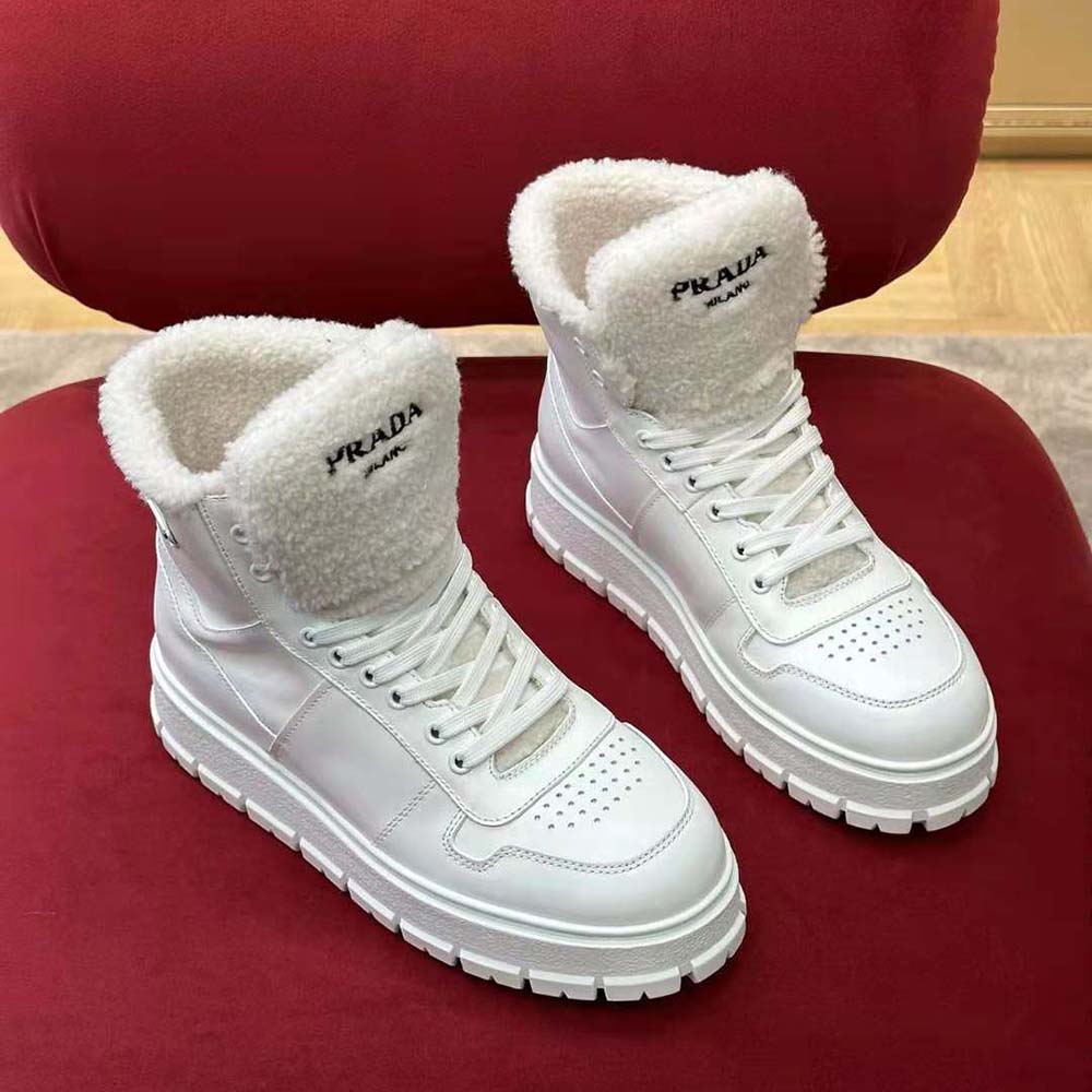 Top angle showing shearling lining in Prada high-top sneakers