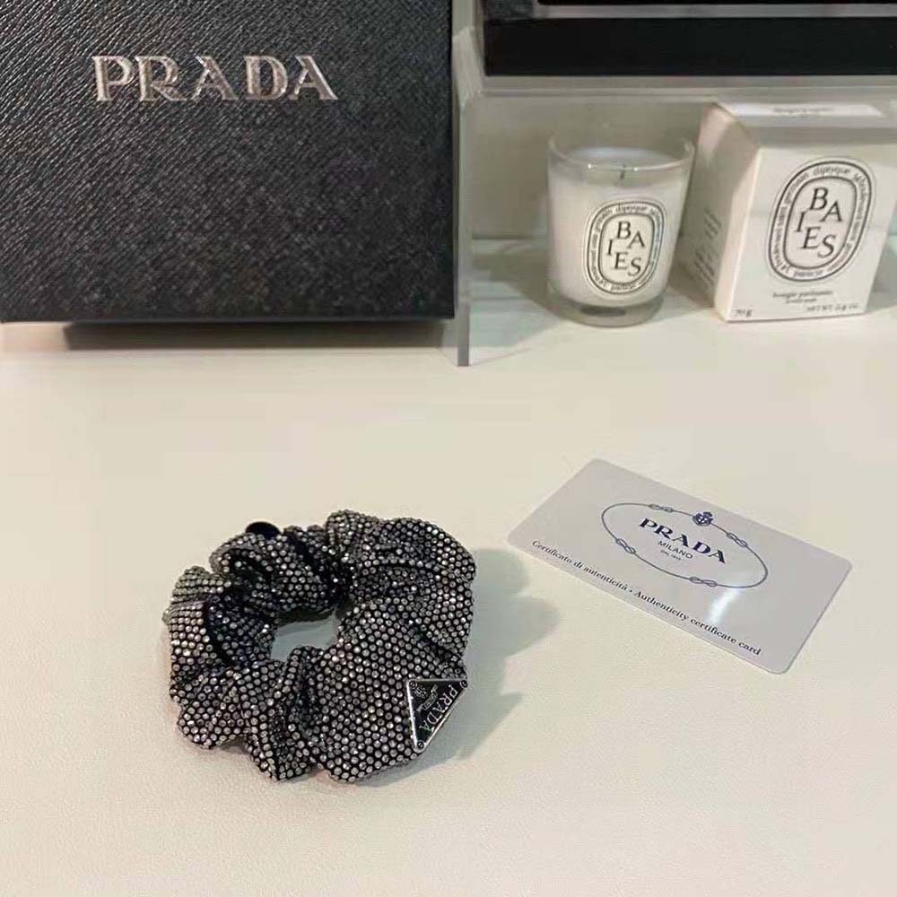 Side view of black satin Prada Women Luminous Crystals Embellish Scrunchie on white background