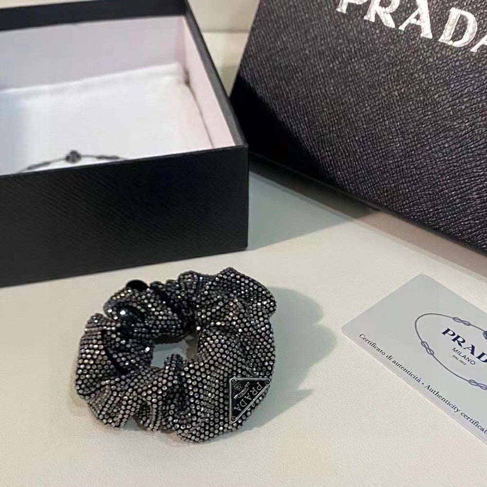 Styled hair with Prada Women Luminous Crystals Embellish Satin Scrunchie in elegant bun