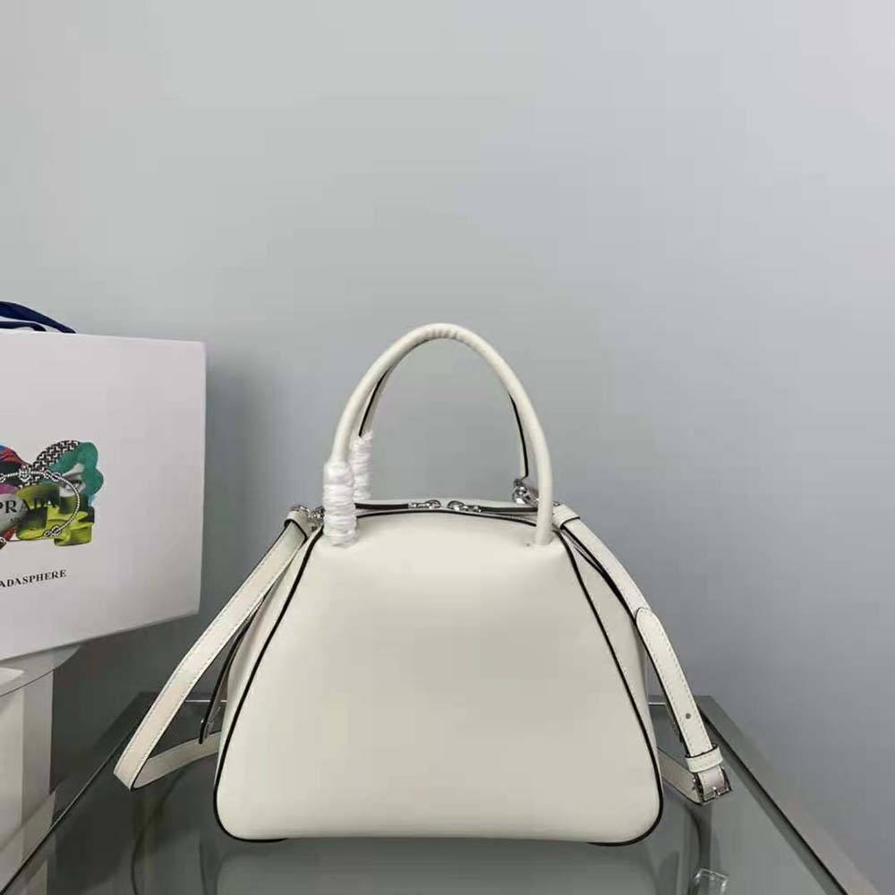 Side profile showing structured silhouette of Prada Women Small Leather Prada Supernova Handbag-White