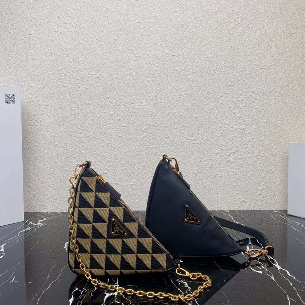 Side angle showing black leather and beige fabric texture on Prada mini bag