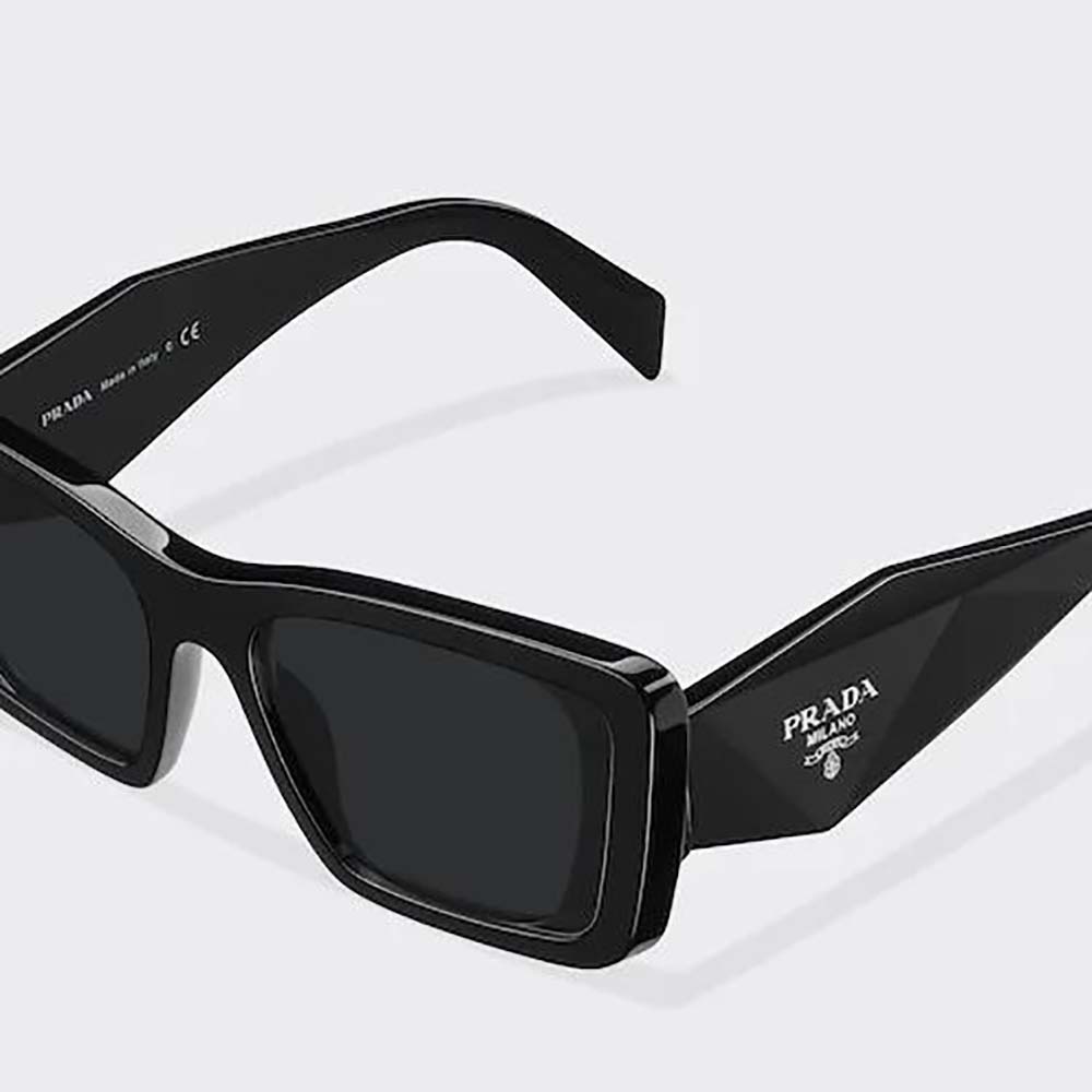 Side angle showing oversized silhouette of Prada Women Symbole Sunglasses