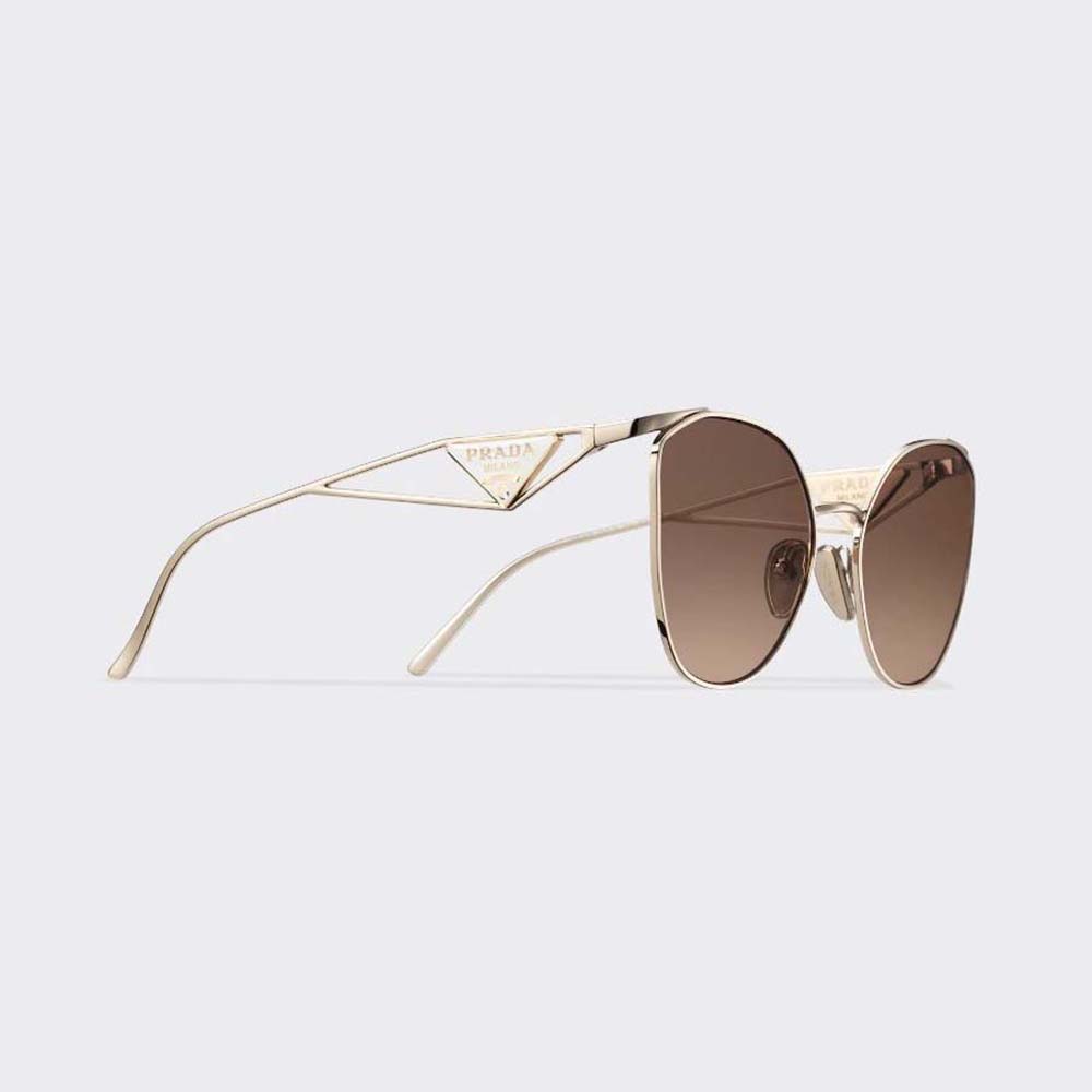 Close-up of silver Prada logo hardware on brown Symbole Sunglasses