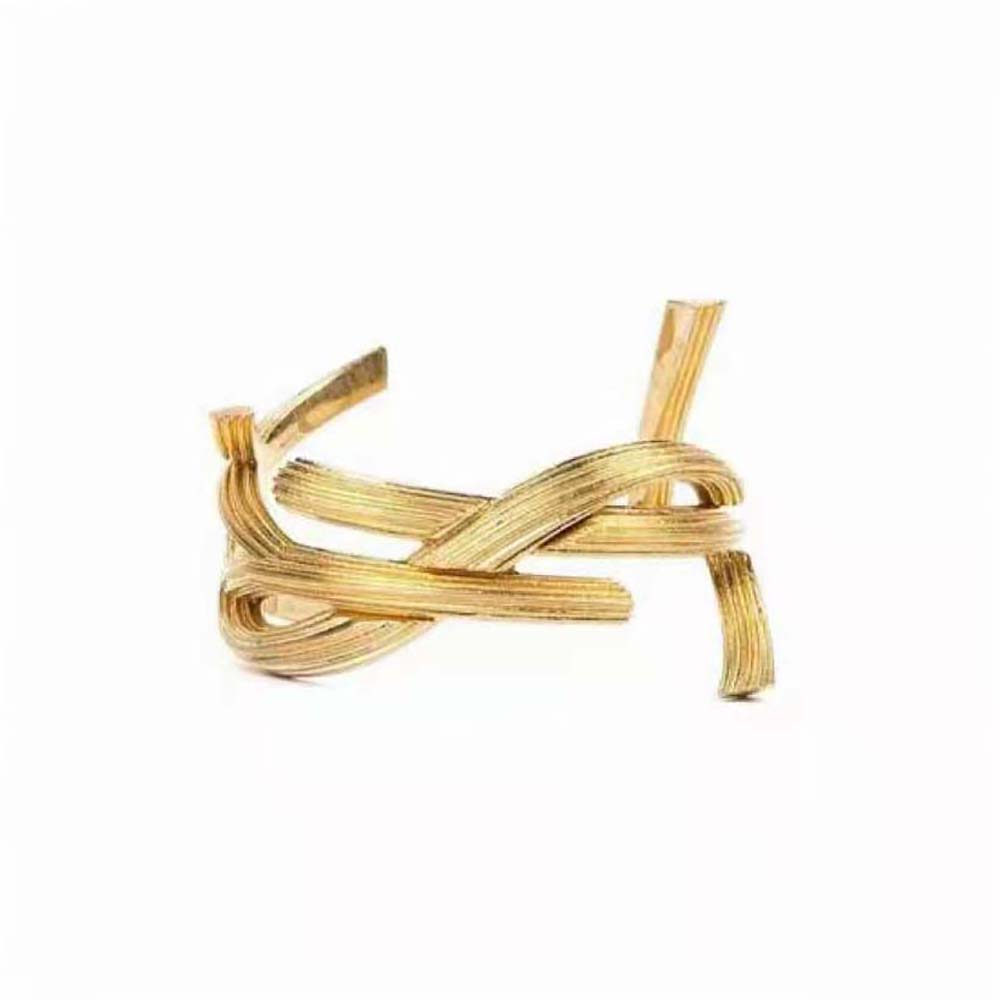 Close-up of Saint Laurent YSL Women Opyum Twist Cuff Bracelet gold metal detail