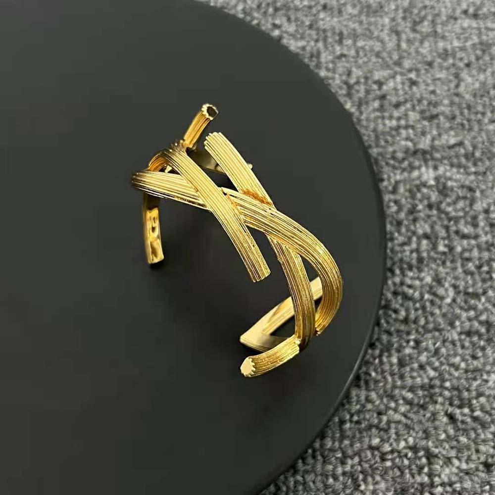Side angle showing twisted silhouette of Saint Laurent YSL Opyum Twist Cuff Bracelet