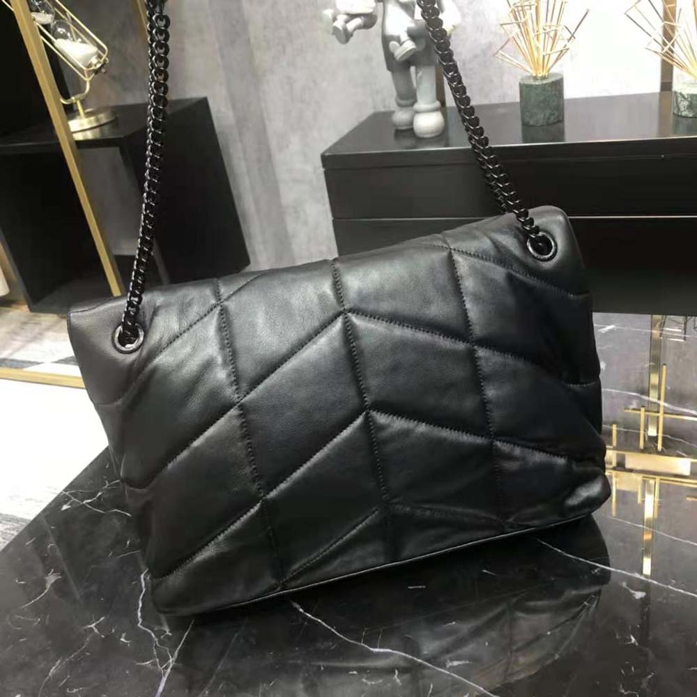 Side profile showing silhouette and chain strap length of Saint Laurent YSL bag