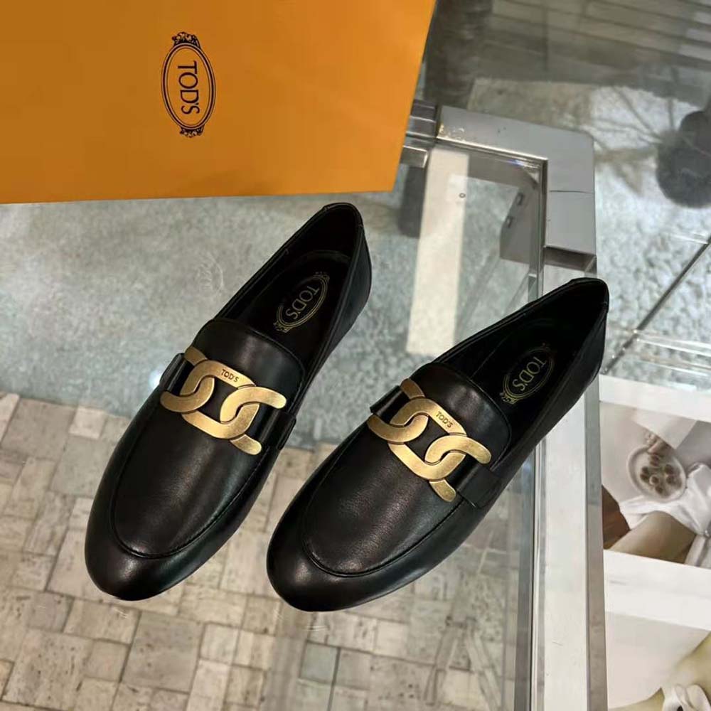 Side profile showing sleek silhouette of TODS Women Kate Loafers in black